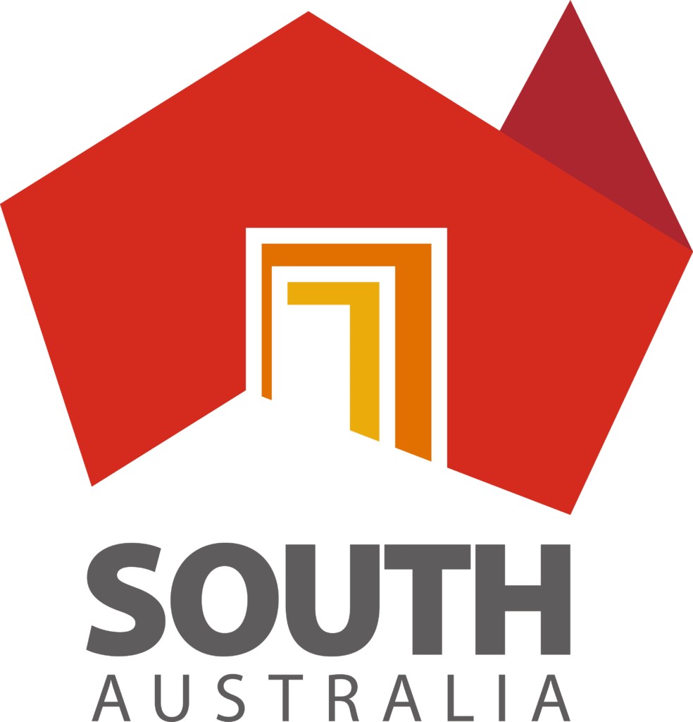 A logo featuring a red abstract shape with a smaller red triangle at the top right, forming the outline of a building. Inside the outline, yellow and orange geometric shapes resemble a doorway. Below this vibrant design, "SOUTH AUSTRALIA" is written in grey capital letters, echoing Elementor's modern aesthetic.