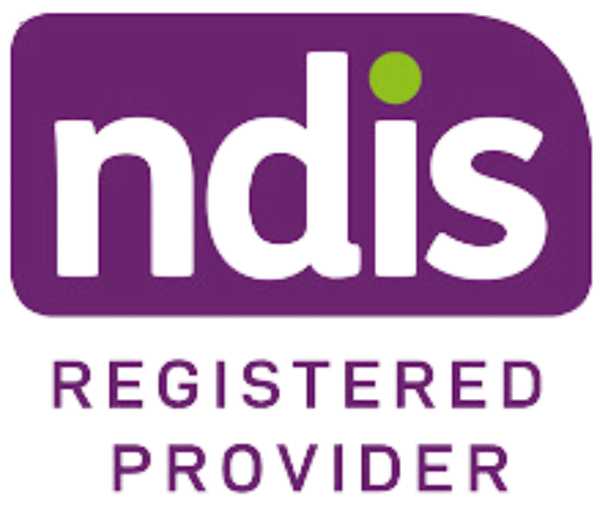 The Image Showcases The Ndis Registered Provider Logo. The &Quot;Ndis&Quot; Text, In Lowercase Green And Purple Letters With A Lime Green Dot On The 'I', Stands Out Against A Purple Background. Below, The Words &Quot;Registered Provider&Quot; Are Clearly Displayed In Purple.