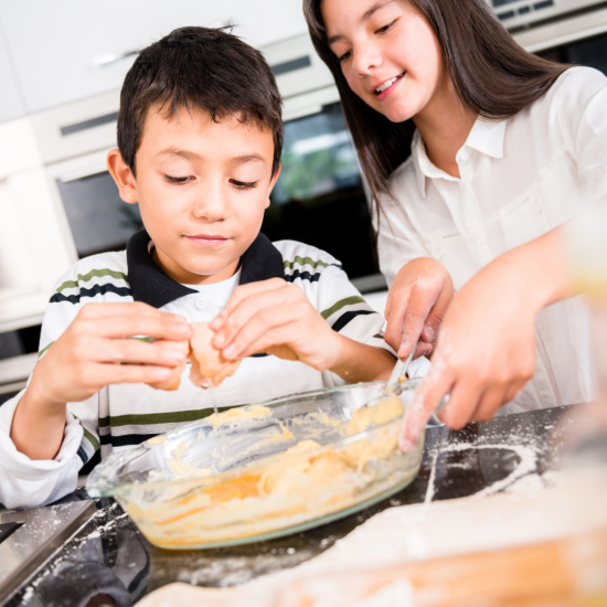 A Boy And A Girl Are Baking Together In A Kitchen As Part Of The Day Options Kids Cooking Program. The Boy Is Cracking An Egg Into A Large Mixing Bowl Filled With Dough, While The Girl Is Stirring The Mixture. There Is Flour Scattered On The Countertop Around Them. They Both Appear Focused On Their Task.